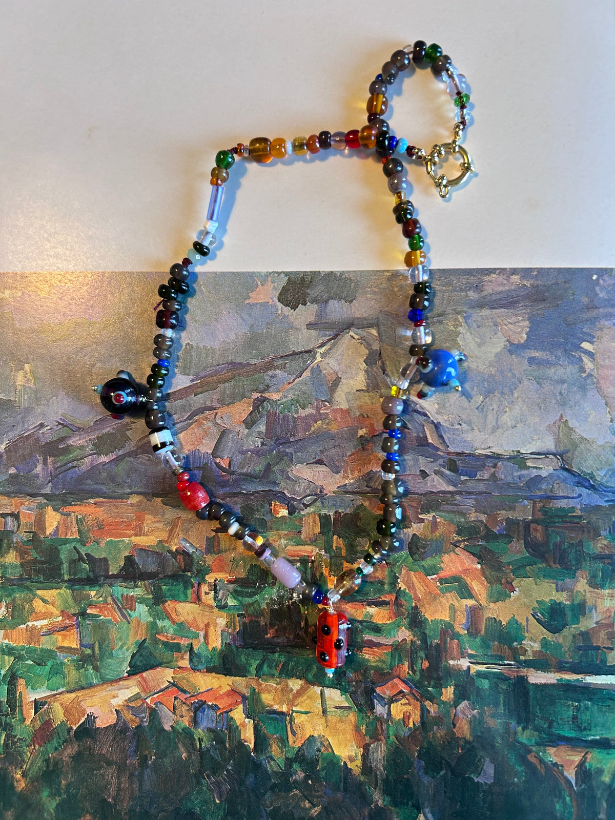 Collana “foglie, cachi, castagne e pianeti”